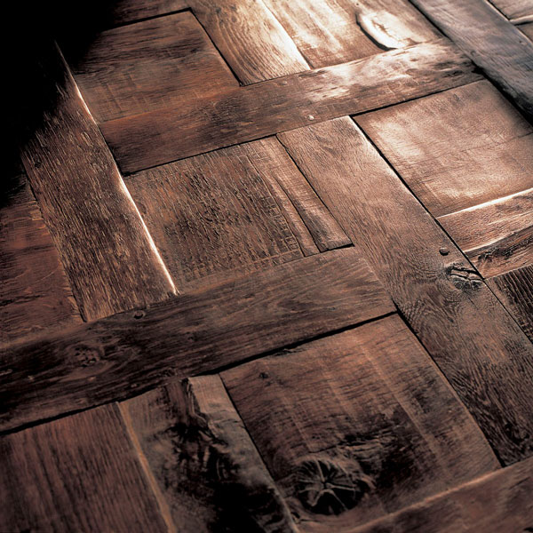Reclaimed 300-year-old French oak laid in a parquet de Chantilly pattern to individual specifications