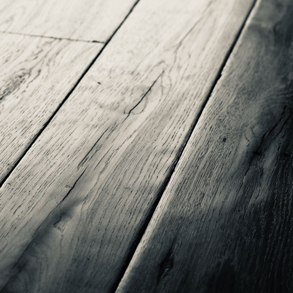 Reclaimed and machined floorboards produce a soft, subtle and timeworn floor