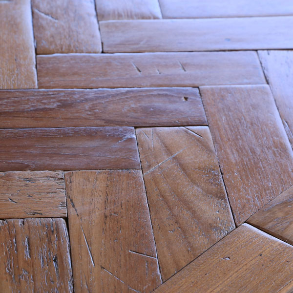 Reclaimed parquet woodblock. Burmese teak laid in single herringbone pattern. Hand DA sanded for a vintage textured floor