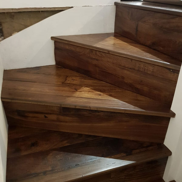 Reclaimed bespoke staircase with kites, winders and straight treads. Made from antique 200-year-old oak